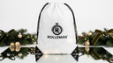 Witte ROLLEMAN®-zak met zwart logo en trekkoorden tussen kerstlichtjes, groen en gouden kerstballen