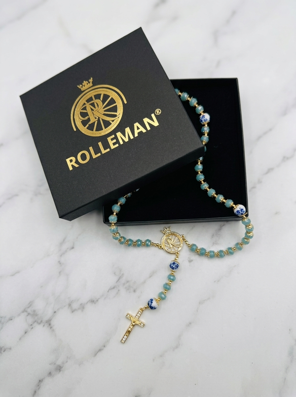 Ave Maria Nomads | Wheel | Turquoise Rosary with Dark Blue Beads - Gold-Plated ROLLEMAN Logo with Cross and Magnetic Closure