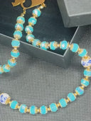 Ave Maria Nomads | Gypsy Wagon | Turquoise Rosary with Dark Blue Beads - Gold-Plated Rolleman Logo with Cross and Magnetic Closure
