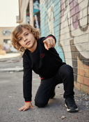 Sweater Tjabo - Kids, zwart met fluor-orange accenten